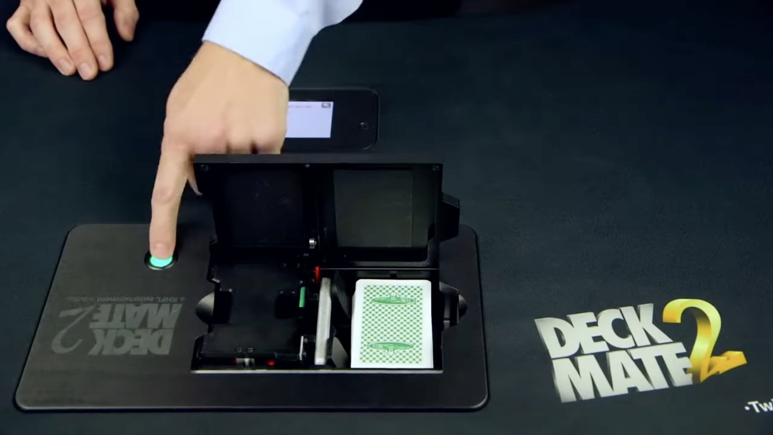 The DeckMate 2 automated card shuffler built into a gaming table