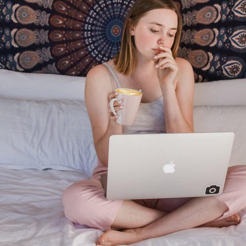 working from home research girl laptop coffee sofa