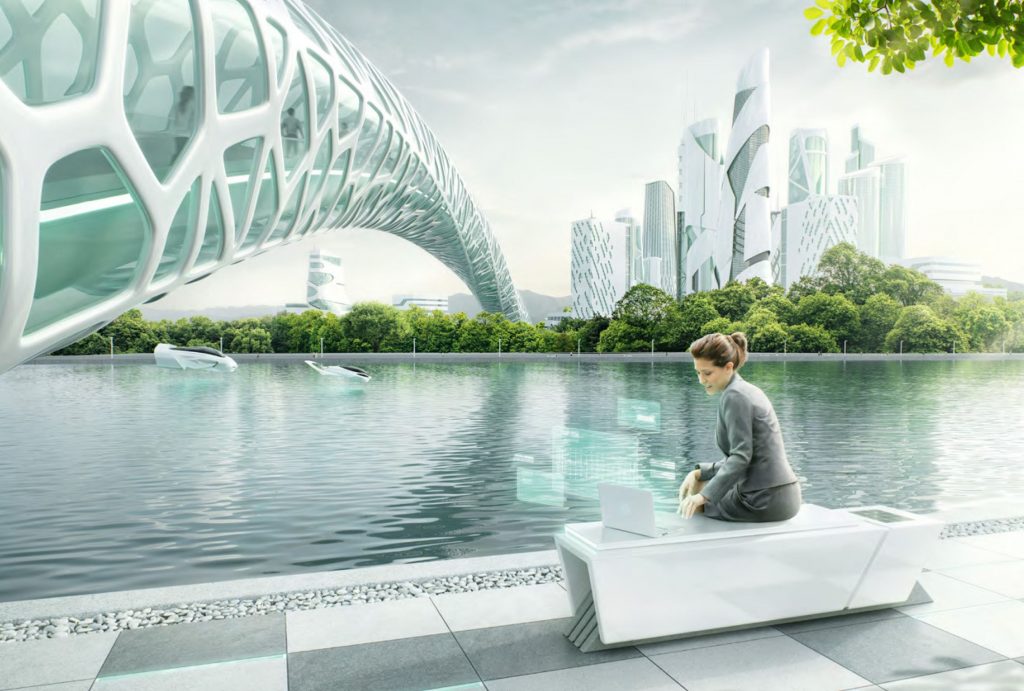 woman working at laptop in a futuristic city lake