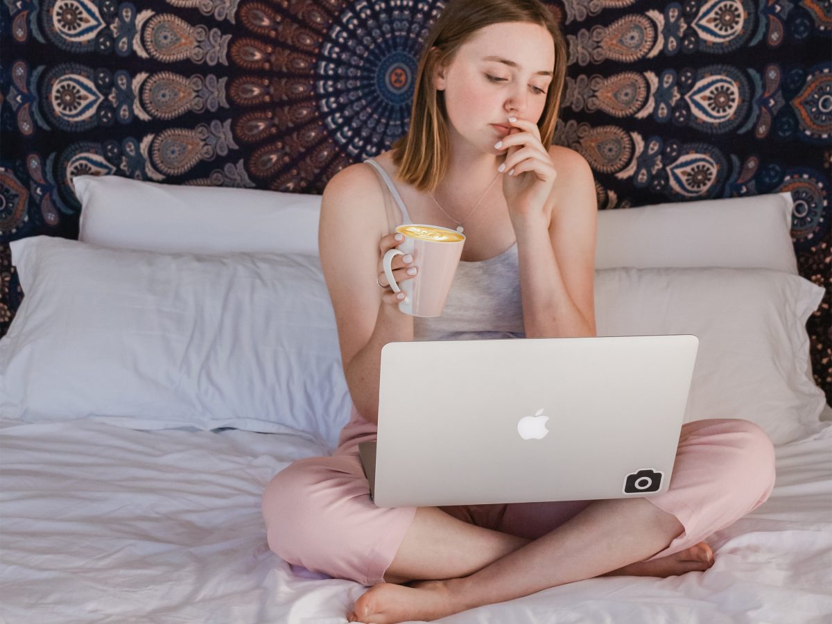 working from home research girl laptop coffee sofa